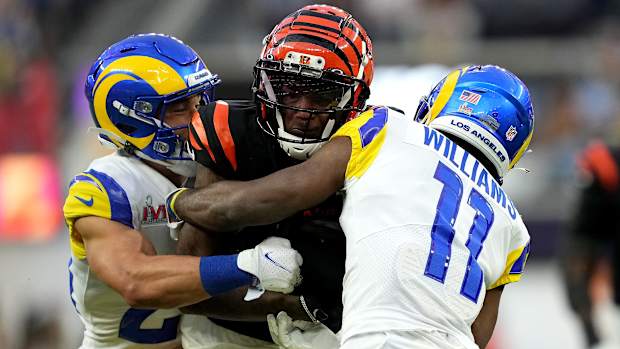 Cincinnati Bengals wide receiver Tee Higgins (85) competes for extra yardage after a catch as Los Angeles Rams cornerback Darious Williams (11) defends in the second quarter during Super Bowl 56, Sunday, Feb. 13, 2022, at SoFi Stadium in Inglewood, Calif. The Cincinnati Bengals lost, 23-30. Nfl Super Bowl 56 Los Angeles Rams Vs Cincinnati Bengals Feb 13 2022 1236